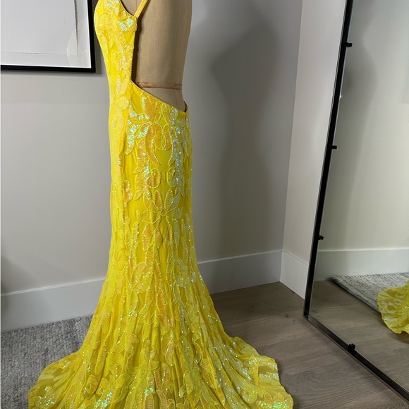 JoVani Yellow Dress
The Jovani 07784A Yellow Pattern Sequin Embellished Gown - Picture 3 of 7